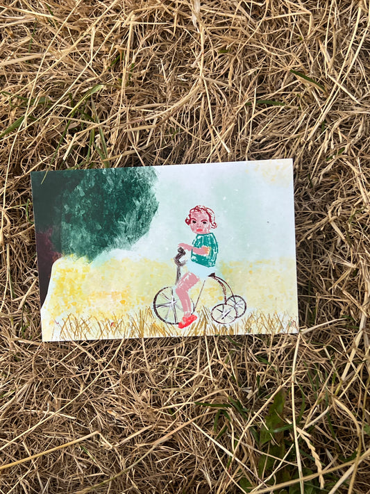 Vintage Postcard – Child on Tricycle in Field